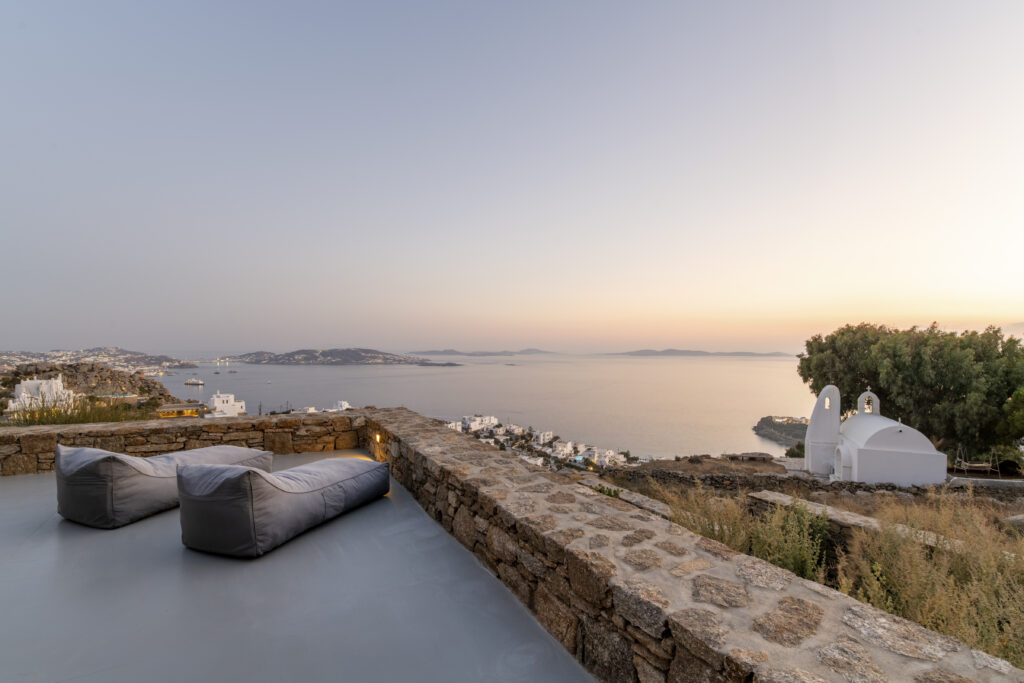 Soft evening light over the sea from a villa terrace in Mykonos