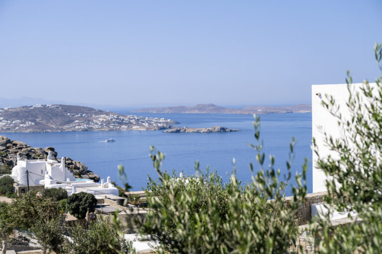 Sea view towards the west coast of Mykonos from a villa terrace
