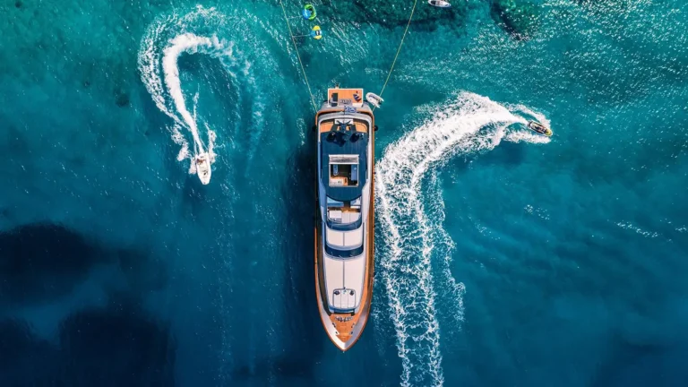 Aerial view of a motor yacht on clear blue water